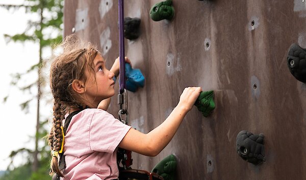 kid on climbing wall