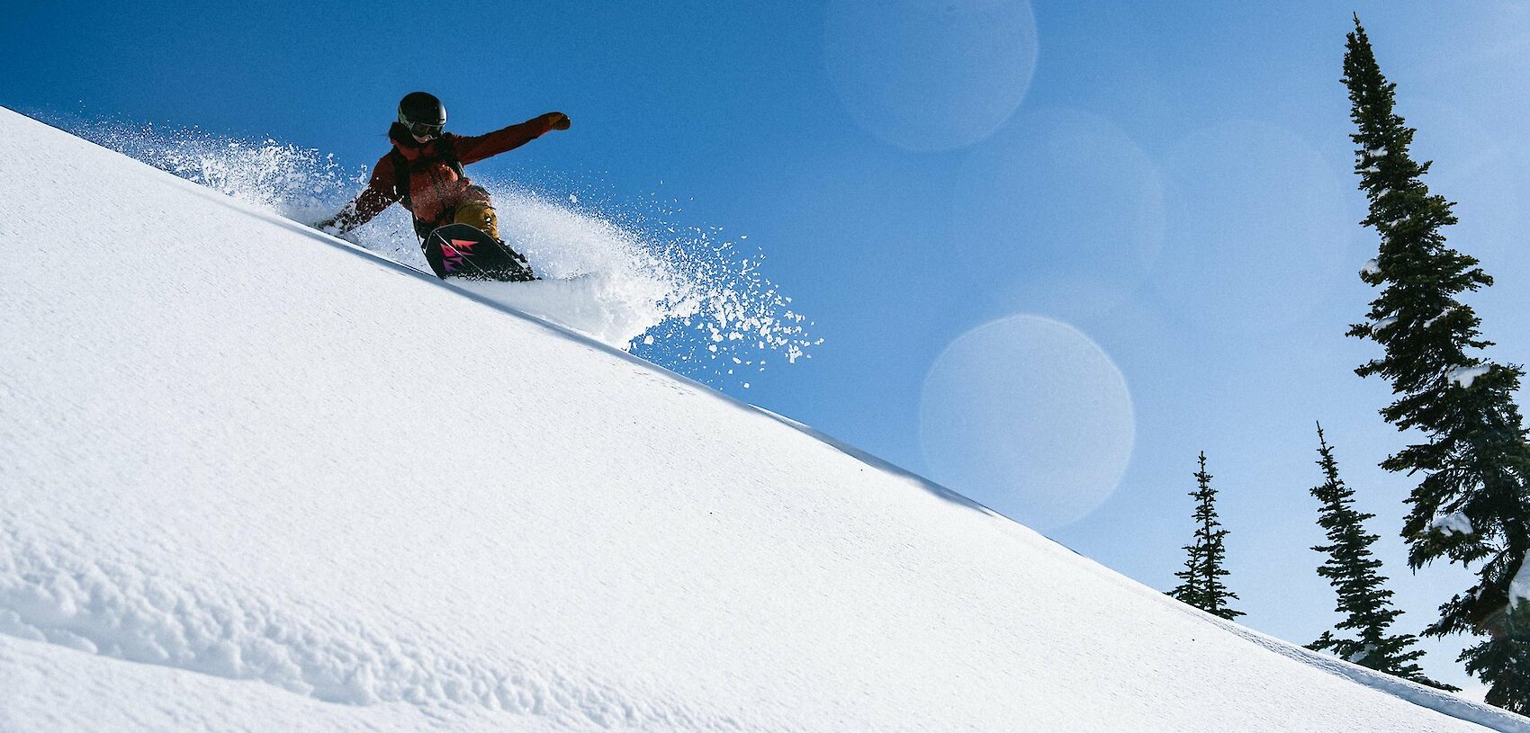 Adventure skier enjoying deep powder and epic terrain at Revelstoke Mountain Resort in British Columbia, a top destination for winter vacations in Canada