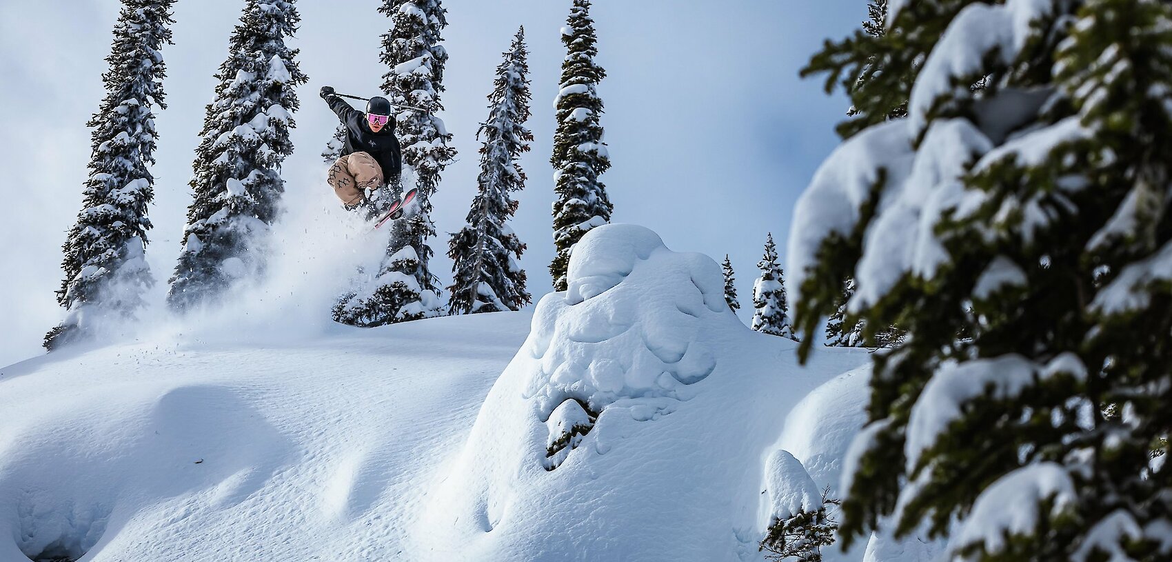 Adventure skier enjoying deep powder and epic terrain at Revelstoke Mountain Resort in British Columbia, a top destination for winter vacations in Canada