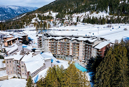 Ski-in ski-out resort with outdoor pool and gondola at mountain base