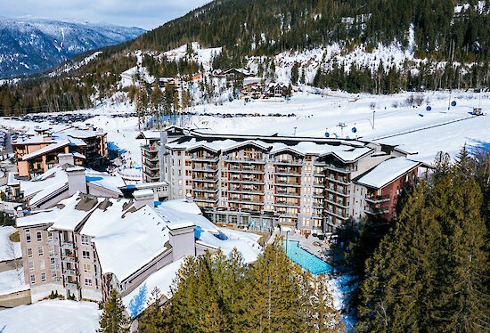 Ski-in ski-out resort with outdoor pool and gondola at mountain base